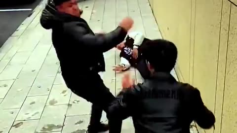 Chinese man doing fighting with 2 boys