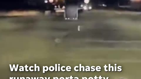 Police chase down runaway porta potty in windy Michigan parking lot