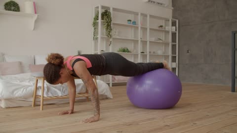 Woman exercising with a giant ball