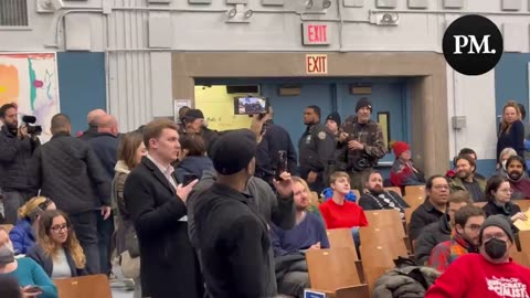 Protestors interrupt AOC during a town hall in Astoria, Queens