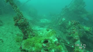 Truk Lagoon SCUBA artillery pieces on deck of Nippo Maru