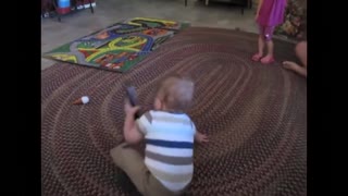 Cute baby so eager to answer a phone call