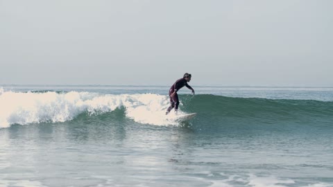 A Male Surfer Riding the Waves
