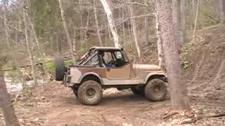 Rick Dehner tries hill climb in the mud.