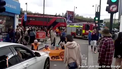 Angry Motorist PHYSICALLY DRAGS Climate Activists Off Street to Unblock Traffic