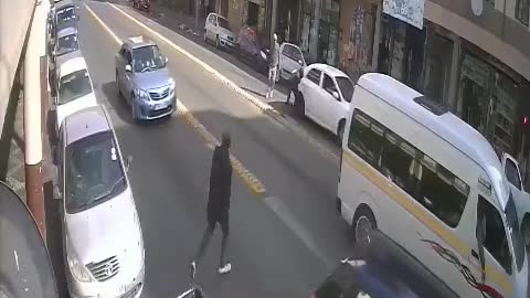 Taxi driver fires shots.