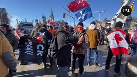 Freedom Convoy supporters hugging each other