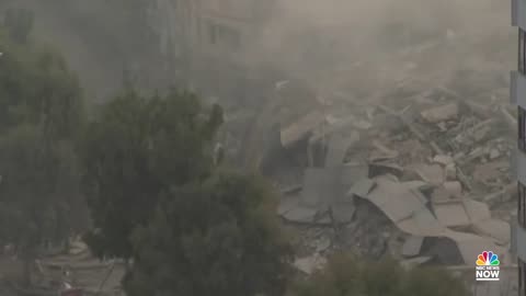 Watch: Building Collapses In Gaza After Being Struck By Israeli Airstrke