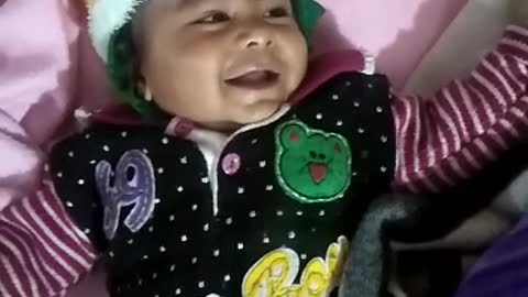 a baby laughing out loud.