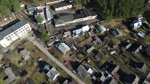 Flight Over Buildings Near Forest 3 Download Free Stock Footage