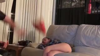 Sleeping woman hit pizza pillow