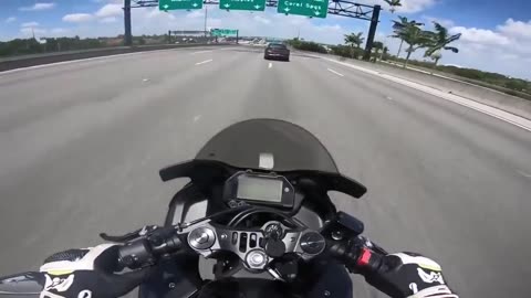 Police officer purposely slams on brakes to get biker to crash into him on the highway