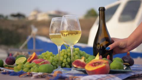 Wine and grapes at the beach