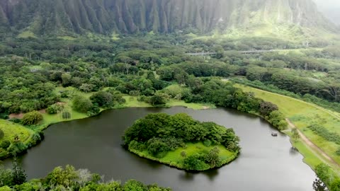 Drone Shot of Lake and Green Mountains