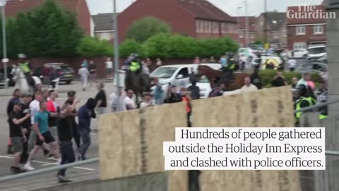 Rioters clash with police and damage hotel housing asylum seekers in Rotherham