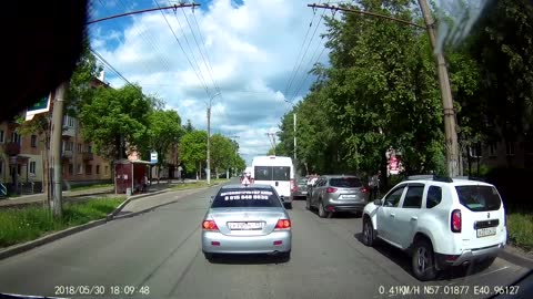 Driver Prevents A Jaywalker From Crossing The Road