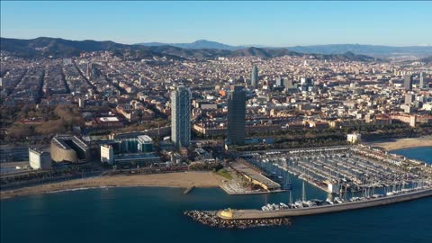 olympic port barcelona spain giant skyscraper and towers sunny aerial day