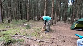 Making a seat to sit on in the woods