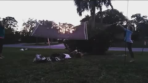 White hammock kid flies off on back