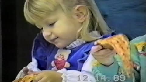 Little Girl Struggles With An Uncooperative Slice Of Pizza