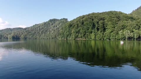 Smooth drone flight over the lake