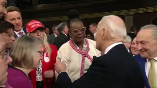 POWERFUL: MTG Gives Biden A Pin Reading "Laken Riley" Before SOTU