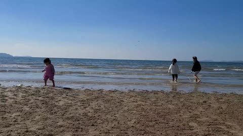 Cute kids having fun in the sea