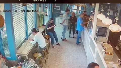 Palestinian terrorist attacks a man with a knife inside a coffeeshop