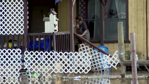 Californians forced into floodwaters to feed pets