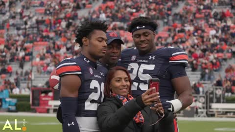 Auburn seniors receive game balls from interim head coach Cadillac Williams on senior day