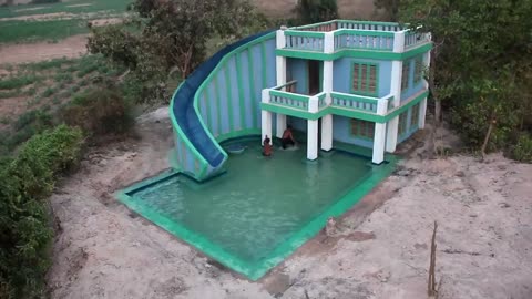 Build a modern mud villa and design a water slide to a beautiful underground pool