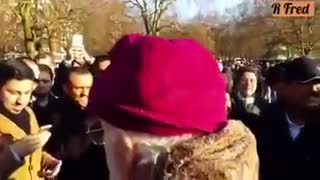 Christian Pensioner surrounded by Muslims at Speakers Corner, Hyde Park, London.