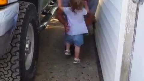 Toddler see dad and can't hold back Her excitement.