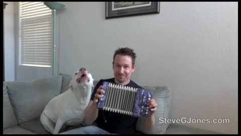 singing dog with his owner