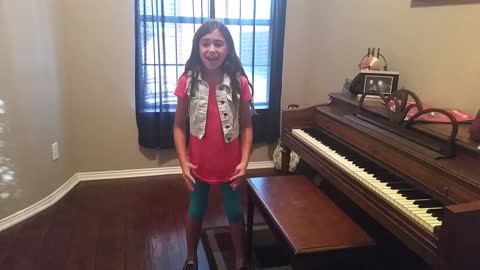 Little girl flawlessly covers classic Journey song