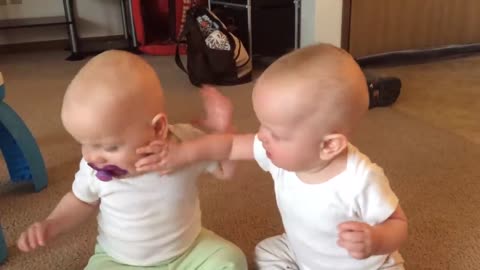 Twin baby girls fight