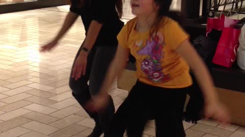 Playing Just dance game at the Mall
