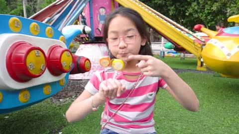 Kid Playing with Lolipops