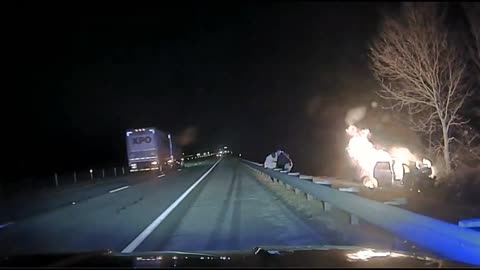 Officer David Moore Pulls A Driver And His Passenger From Their Crashed Vehicle