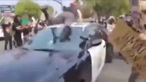 Antifa soy boy jumps on cop car, GETS REKT!