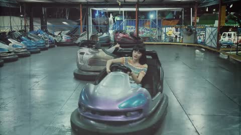 Women playing with bumper cars