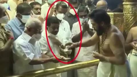 K Radhakrishnan, Devaswom Minister in Kerala, using holy Sabarimala Temple water as hand sanitiser