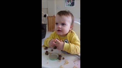 Baby perfects her table manners