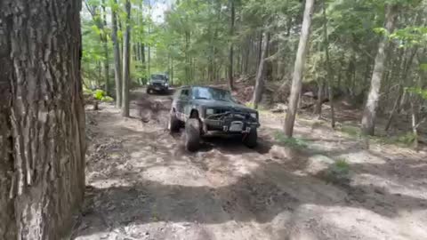 Ram and Jeeps cross shallow mud hole