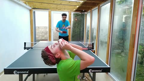 Blows A Ping Pong Ball While His Friend Makes A Shot To Hit It - Awesome Trickshot