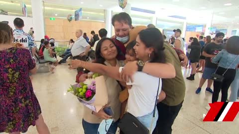 Tears and hugs aplenty at Sydney Airport for Christmas travellers | 7NEWS