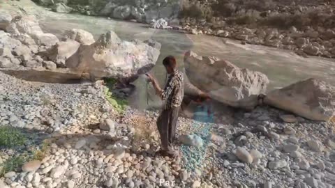 Fishing in the roaring river by a nomadic family: Babak and Narges...Iran 2023