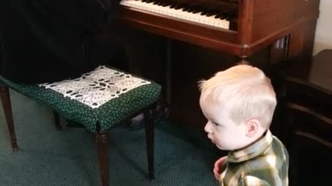 Grandson Dancing To Grandma Playing Piano