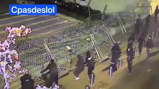 Rioters tear down Police fencing in France!