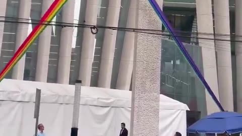 Mexico city workers make it clear what they think of the LGBTQWXYZ flag hanging from their building